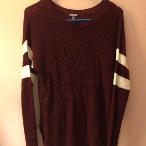 Red sweater with stripped sleeves